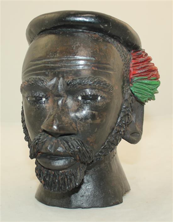 An African painted terracotta jar modelled as the head of a bearded man, 7.5in.